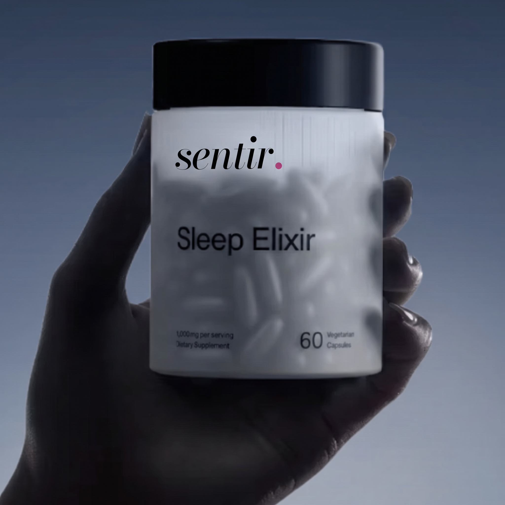 Hand holding a Sentir Sleep Elixir bottle